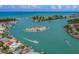 Breathtaking aerial view of a stunning waterfront neighborhood with turquoise water and private docks at 929 Cypress Ave, Venice, FL 34285