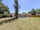 A spacious backyard with a patio, perfect for outdoor living and entertainment at 929 Cypress Ave, Venice, FL 34285