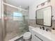 Stylish bathroom with a glass-enclosed shower, modern vanity, and elegant fixtures at 929 Cypress Ave, Venice, FL 34285