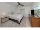 Serene bedroom with a ceiling fan, a window and neutral décor at 929 Cypress Ave, Venice, FL 34285