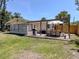 Back of house featuring a patio area with barbecue and outdoor dining, great for outdoor enjoyment at 929 Cypress Ave, Venice, FL 34285