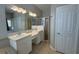 Bathroom featuring a double sink vanity, shower, tub and separate toilet area at 98 Maltby St, Port Charlotte, FL 33953
