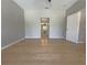 Comfortable bedroom with new floors, ceiling fan, and bathroom at 98 Maltby St, Port Charlotte, FL 33953