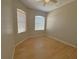 Bedroom with laminated wood flooring, neutral walls, and natural light at 98 Maltby St, Port Charlotte, FL 33953