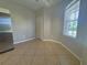Cozy breakfast nook with tile flooring, a window with blinds, and a view to the side yard at 98 Maltby St, Port Charlotte, FL 33953