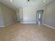 Open concept floor plan with tile flooring and neutral color scheme at 98 Maltby St, Port Charlotte, FL 33953