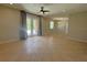 Large living space with sliding glass doors, tile flooring, and plenty of natural light at 98 Maltby St, Port Charlotte, FL 33953