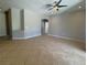 Open concept living room boasting tile flooring and a view of other rooms in the home at 98 Maltby St, Port Charlotte, FL 33953