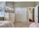 Bright bedroom features two twin beds, closet, and television set for a cozy space at 1037 Beckley Cir, Venice, FL 34292