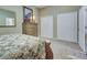 Bedroom with a decorative bed, dresser, neutral carpeting, and closet at 1037 Beckley Cir, Venice, FL 34292