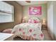 Cozy bedroom with neutral walls, carpet, and window with blinds offers a comfortable retreat at 1037 Beckley Cir, Venice, FL 34292