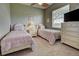 Shared bedroom with two twin beds, a center nightstand, and neutral colored walls at 1037 Beckley Cir, Venice, FL 34292