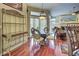 Formal dining area with hardwood floors, decorative shelving and natural light at 1037 Beckley Cir, Venice, FL 34292