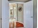 Open foyer with hardwood floors, decorative lighting, and an inviting entryway creates a warm welcome at 1037 Beckley Cir, Venice, FL 34292