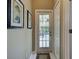 Hallway with a glass door leading to the outdoor patio and pool area at 1037 Beckley Cir, Venice, FL 34292