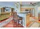 Open kitchen with granite countertops, stainless steel appliances, and breakfast bar seating, perfect for casual dining and entertaining at 1037 Beckley Cir, Venice, FL 34292