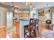 Well-appointed kitchen with granite countertops, wood cabinetry, and pendant lighting, offering a stylish and functional cooking space at 1037 Beckley Cir, Venice, FL 34292