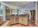 Spacious kitchen featuring a large island, stainless steel appliances and hardwood floors at 1037 Beckley Cir, Venice, FL 34292