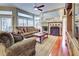 Comfortable living room with a fireplace, hardwood floors and plenty of natural light at 1037 Beckley Cir, Venice, FL 34292
