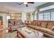 Inviting living room featuring hardwood floors, plush sofas and a cozy atmosphere at 1037 Beckley Cir, Venice, FL 34292