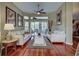 Bright living room with hardwood floors, neutral decor, and natural light creating a warm and inviting space at 1037 Beckley Cir, Venice, FL 34292
