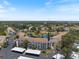 Condo building near lake and surrounding community with mature landscaping at 1156 Bird Bay Way # 104, Venice, FL 34285