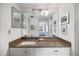 Bathroom vanity with a granite countertop, decor and a view into the bedroom at 1156 Bird Bay Way # 104, Venice, FL 34285