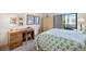 Cozy bedroom with a view of the lanai and ample natural light at 1156 Bird Bay Way # 104, Venice, FL 34285