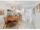 Dining area adjacent to the kitchen and living room, perfect for entertaining at 1156 Bird Bay Way # 104, Venice, FL 34285