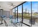 Screened lanai provides serene water views and access to the outdoors at 1156 Bird Bay Way # 104, Venice, FL 34285