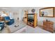 Inviting living room with tile floors, comfortable seating, and natural light at 1156 Bird Bay Way # 104, Venice, FL 34285