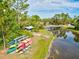 Scenic lake view with available kayaks and bridge in the distance at 11648 Okaloosa Dr, Venice, FL 34293