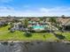 Inviting pool area with a gazebo, comfortable seating, and lush landscaping surrounded by well-maintained homes at 11648 Okaloosa Dr, Venice, FL 34293