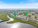 Aerial shot of condo community, highlighting the pool, boardwalk, and waterfront location at 1190 Bird Bay Way # 309, Venice, FL 34285
