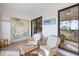 Relaxing balcony with wicker seating and tropical-themed decor at 1190 Bird Bay Way # 309, Venice, FL 34285