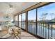 Enclosed lanai with ample seating, and water views at 1190 Bird Bay Way # 309, Venice, FL 34285