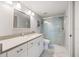 Modern bathroom with marble floors, glass shower, and quartz countertop at 1190 Bird Bay Way # 309, Venice, FL 34285