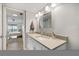 Bright bathroom with modern fixtures, vanity, and an open doorway to a bedroom at 1190 Bird Bay Way # 309, Venice, FL 34285