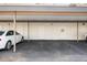 Carport parking at condo community with white storage lockers for each unit at 1190 Bird Bay Way # 309, Venice, FL 34285