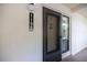 Entrance to the unit at 1190, with dark door and textured walls at 1190 Bird Bay Way # 309, Venice, FL 34285