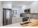 Modern kitchen with quartz countertops, stainless appliances, and ample cabinet space at 1190 Bird Bay Way # 309, Venice, FL 34285