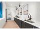 Modern kitchenette with sleek cabinetry, marble countertops, and stylish decor at 12450 Somatic Ct, Venice, FL 34293