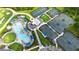 Aerial view showcasing a community pool, tennis courts, and a well-maintained green space, ideal for active living at 12548 Wellen Golf St, Venice, FL 34293