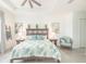 Bright bedroom with a large bed and decorative accents at 12548 Wellen Golf St, Venice, FL 34293