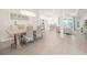 Bright open-concept dining area with wood floors and modern living space at 12548 Wellen Golf St, Venice, FL 34293
