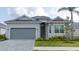 Charming single-Gathering home with a two-car garage and well-maintained landscaping at 12548 Wellen Golf St, Venice, FL 34293
