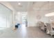 Spacious open-concept living area with lots of natural light, wood floors, and dining area at 12548 Wellen Golf St, Venice, FL 34293