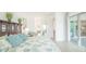 Bright main bedroom with slider leading to the patio and a walk-in closet and ensuite bathroom at 12548 Wellen Golf St, Venice, FL 34293