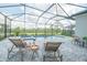 Relaxing screened-in pool area featuring comfortable lounge chairs and a tranquil view of the natural surroundings at 12548 Wellen Golf St, Venice, FL 34293