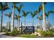 Entrance to Downtown Wellen Park with palm trees at 12548 Wellen Golf St, Venice, FL 34293